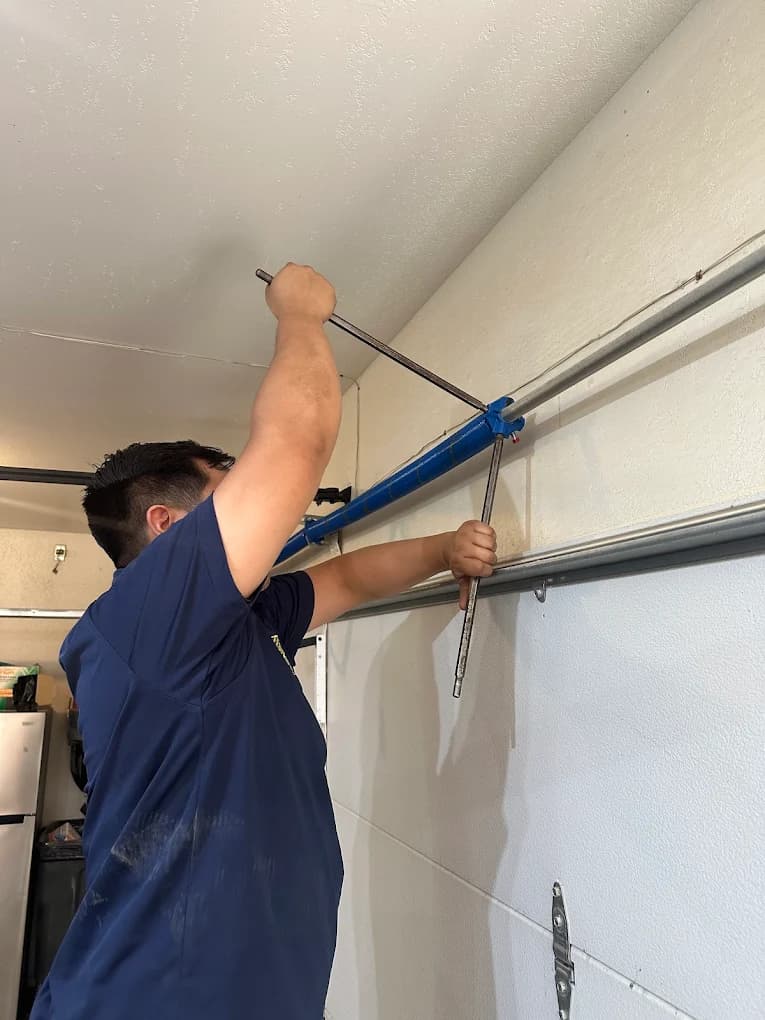 Real Garage Door Pros technician performing a garage door repair in Las Vegas